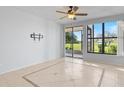 Living room with tile floors and sliding glass doors at 603 Sweet Bay Cir # 603, Winter Haven, FL 33884