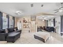 Spacious living room featuring a sectional sofa and tile flooring at 910 Nancy Ct, Kissimmee, FL 34759