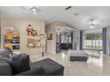 Open-concept living room with views into the kitchen at 910 Nancy Ct, Kissimmee, FL 34759