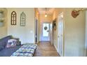 Bright entryway with wood-look floors and a comfortable couch at 1490 Meadows Pond Dr, Bartow, FL 33830