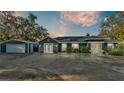 House exterior with detached garage at 1769 S Lake Reedy Blvd, Frostproof, FL 33843