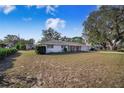 Single story home with a large front yard at 203 E Orange St, Davenport, FL 33837