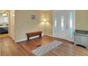 Bright entryway with bench and view to bedroom at 6308 Bayberry Ne Blvd, Winter Haven, FL 33881