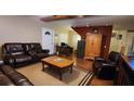 Relaxing living room with leather furniture and hardwood floors at 1190 S Goodman Rd, Champions Gate, FL 33896