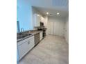 Modern kitchen featuring stainless steel appliances and white cabinets at 2137 Emma Ln, Lake Wales, FL 33859
