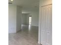 Open concept floor plan with tile flooring and access to other rooms at 1218 Navel Rd, Bartow, FL 33830