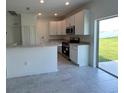 Modern kitchen with stainless steel appliances and breakfast bar at 1057 Bergamot Dr, Bartow, FL 33830