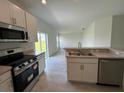 Stainless steel appliances and an eat-in kitchen area at 1057 Bergamot Dr, Bartow, FL 33830