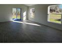 Bright and spacious living area with tile flooring and sliding glass doors leading to the backyard at 2169 Emma Ln, Lake Wales, FL 33859