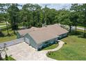 Aerial view showcasing a single-story house, a spacious yard, and a unique driveway at 213 Riverbend Rd, Ormond Beach, FL 32174