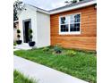Charming home exterior with wood and brick accents at 210 W Illiana St, Orlando, FL 32806