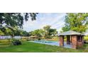 Inviting pool area with brick patio and gazebo; perfect for relaxation at 8375 Ne Jacksonville Rd, Ocala, FL 34479