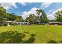 Spacious backyard with large grassy area, providing ample outdoor space at 8375 Ne Jacksonville Rd, Ocala, FL 34479
