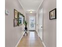 Bright entryway with tile flooring and mirror at 2720 Monticello Way, Kissimmee, FL 34741