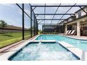 Inviting pool and spa with screened enclosure at 1502 Moon Valley Dr, Davenport, FL 33896