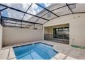 Private screened-in pool and spa in backyard at 1688 Tropical Palms Cir, Kissimmee, FL 34747