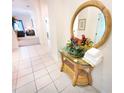 Welcoming entryway with a mirror and decorative floral arrangement at 716 Lucaya Loop # B1/U716, Davenport, FL 33897