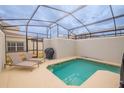 Private screened-in pool with lounge chairs at 8982 Stinger Dr, Champions Gate, FL 33896