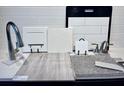 Display of kitchen design options, including flooring and countertops at 3860 Bannock Ave, Tavares, FL 32778