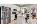 Modern kitchen with stainless steel appliances at 6943 Cupseed Ln, Harmony, FL 34773