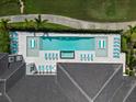 Aerial view of a rectangular pool with lounge chairs at 350 Muirfield Loop, Reunion, FL 34747