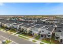 Aerial view of a large suburban community with many houses at 9119 Sommerset Hills Dr, Davenport, FL 33896