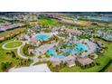 Resort-style community pool with multiple pools and landscaping at 785 Ocean Course Ave # 785, Davenport, FL 33896