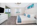 Spacious main bedroom with a king-size bed and private balcony access at 785 Ocean Course Ave # 785, Davenport, FL 33896