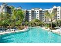 Expansive resort-style pool with plenty of lounge chairs for relaxing at 14501 Grove Resort Ave # 3535, Winter Garden, FL 34787