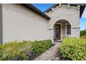 Brick walkway to the front door of a beige house at 793 Asturias Rd, Davenport, FL 33837
