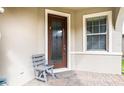 Modern front door with glass panels and side window at 793 Asturias Rd, Davenport, FL 33837