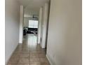 Bright entryway with tile floors leading to living room at 8581 Rindge Rd, Polk City, FL 33868