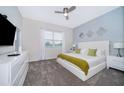 Main bedroom with king-size bed, large window, and ample closet space at 769 Ocean Course Ave # 769, Davenport, FL 33896