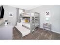 Bedroom with a bunk bed and a twin-size bed at 769 Ocean Course Ave # 769, Davenport, FL 33896