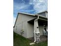 Side view showcasing exterior, gutters, and landscaping at 3253 Wauseon Dr, Saint Cloud, FL 34772