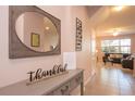 Bright and airy entryway with mirror and console table at 3171 Tocoa Cir, Kissimmee, FL 34746