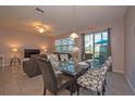 Casual dining area with glass table and patterned chairs at 3171 Tocoa Cir, Kissimmee, FL 34746