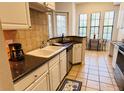 Well-equipped kitchen with breakfast nook and ample counter space at 501 Mirasol Cir # 203, Celebration, FL 34747