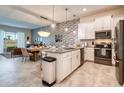 Modern kitchen with island and stainless steel appliances at 891 Ocean Course Ave # 0, Davenport, FL 33896