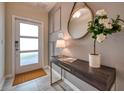 Bright entryway with modern console table and mirror at 891 Ocean Course Ave # 0, Davenport, FL 33896