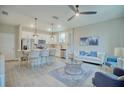Open concept living room, kitchen, and dining area with modern decor at 1670 Houston St, Kissimmee, FL 34743