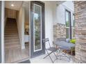 Townhouse entry with small patio and staircase leading upstairs at 1670 Houston St, Kissimmee, FL 34743