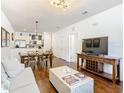 Open concept living area with kitchen, dining, and living spaces at 5362 Diplomat Ct # 103, Kissimmee, FL 34746