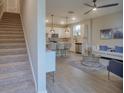 Carpeted stairs leading to the open-concept living space at 1690 Houston St, Kissimmee, FL 34743