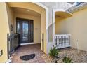Elegant entryway with arched details and decorative door at 804 San Raphael St, Poinciana, FL 34759