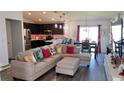 Open concept living area with kitchen, dining, and living room at 305 Cascara Ln, Auburndale, FL 33823