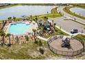 Community pool, playground, and parking area at 132 Pineywoods St, Saint Cloud, FL 34772