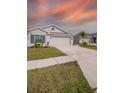 Light gray house exterior with attached garage at 132 Pineywoods St, Saint Cloud, FL 34772