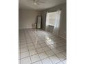 Bright living room featuring tile flooring and neutral color palette at 606 Mayan Pl, Kissimmee, FL 34758