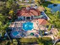 Aerial view of community pool, spa, and clubhouse at 8403 Blue Lagoon Dr, Kissimmee, FL 34747